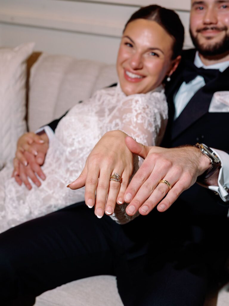 Newlyweds showing wedding rings